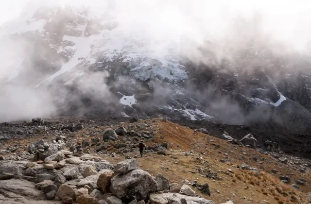 hikers-walking-towards-big-snowy-mountain-salkantay-andes-mountain-range