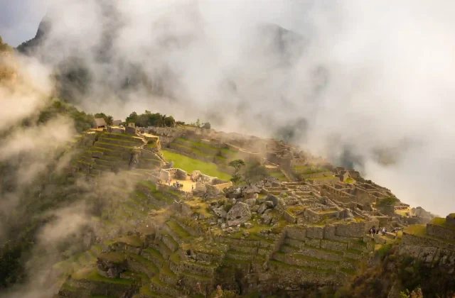 machu-picchu-illuminated-by-first-sunlight-coming-out-from-opening-clouds